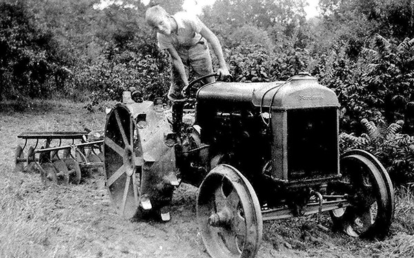 Clarence Atwood riding the family tractor