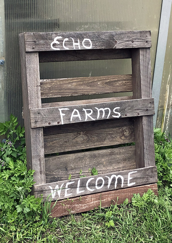 sign at the entrance to the greenhouse