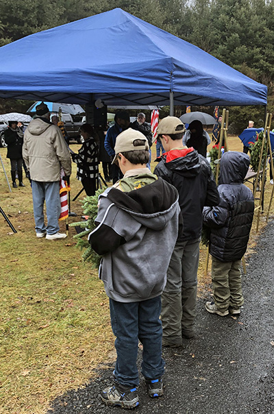 Scouts waiting to place wreathe at grave sites.